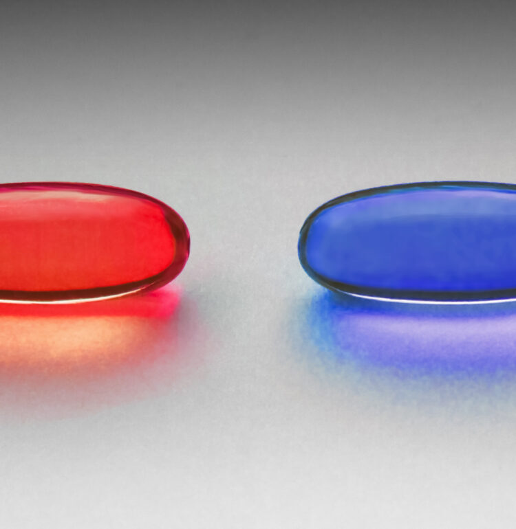 Red and blue pill as in the Matrix. The original photo is of two yellow omega-3 capsules, placed on a grainy paper on a windowsill. Light all natural from the window. Processed in Photoshop for color. Photographed in Visby, Gotland, Sweden.