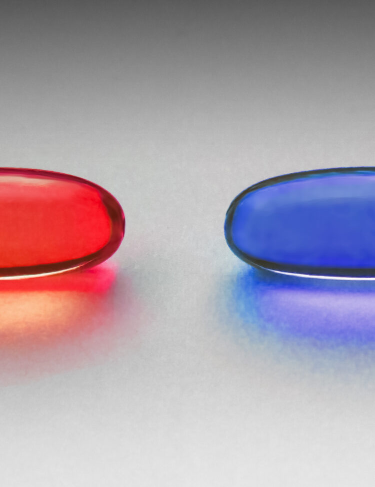 Red and blue pill as in the Matrix. The original photo is of two yellow omega-3 capsules, placed on a grainy paper on a windowsill. Light all natural from the window. Processed in Photoshop for color. Photographed in Visby, Gotland, Sweden.