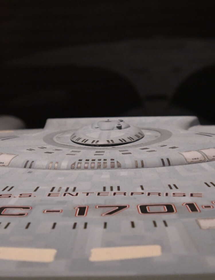 This model of the USS Enterprise star ship NCC-1701-D was used in The Next Generation from 1987-1994. This filming miniature was about 5 feet long! During the summer of 2019, the traveling exhibit "Star Trek: Exploring New Worlds" exhibit was featured at the Henry Ford Museum in Dearborn, Michigan. This is a photo of one of the Star Trek - The Next Generation displays. Taken in August, 2019, near the end of the exhbit's run.