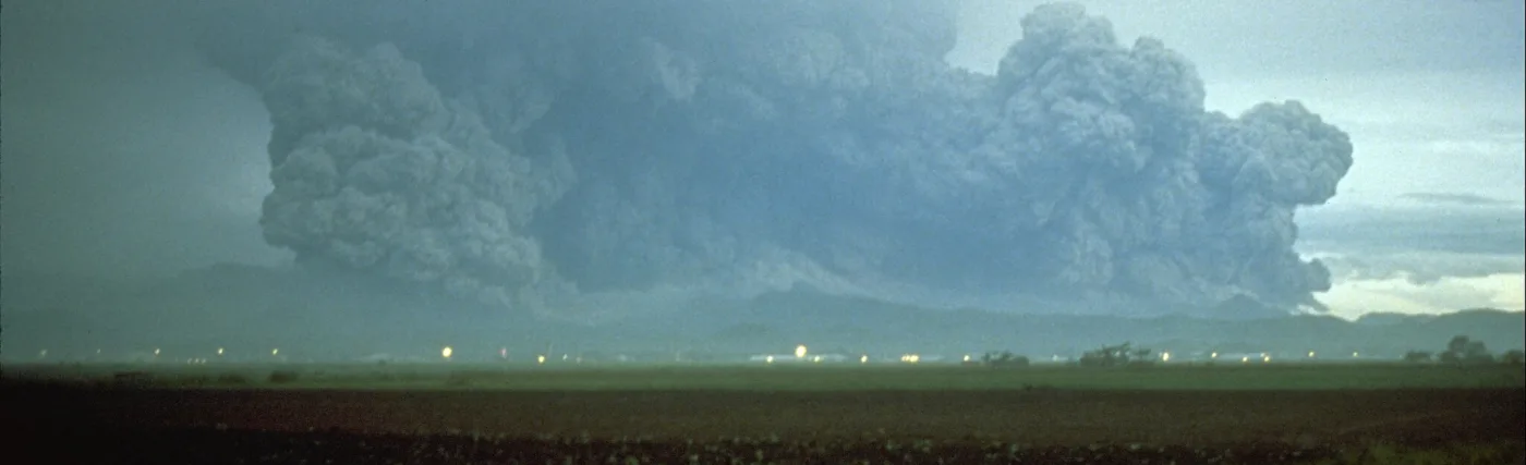 Mount Pinatubo at daybreak on June 15, 1991, a few minutes after the start of the climactic eruption.