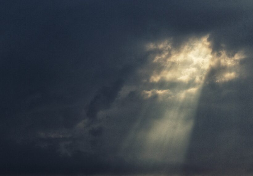 The warm light of the Sun punches through the darkness of the Storm.