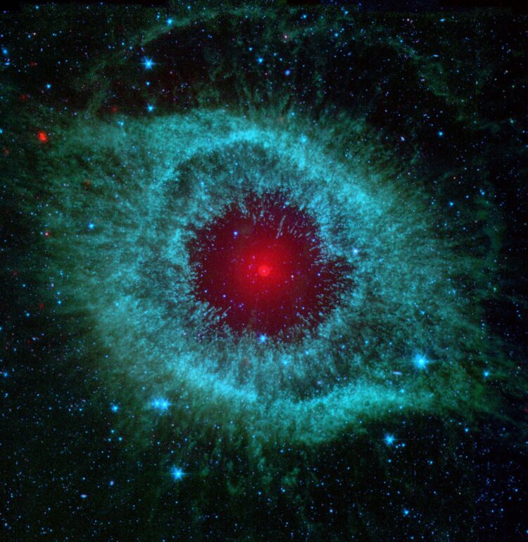 This infrared image from NASA's Spitzer Space Telescope shows the Helix Nebula, a cosmic starlet often photographed by amateur astronomers for its vivid colors and eerie resemblance to a giant eye.