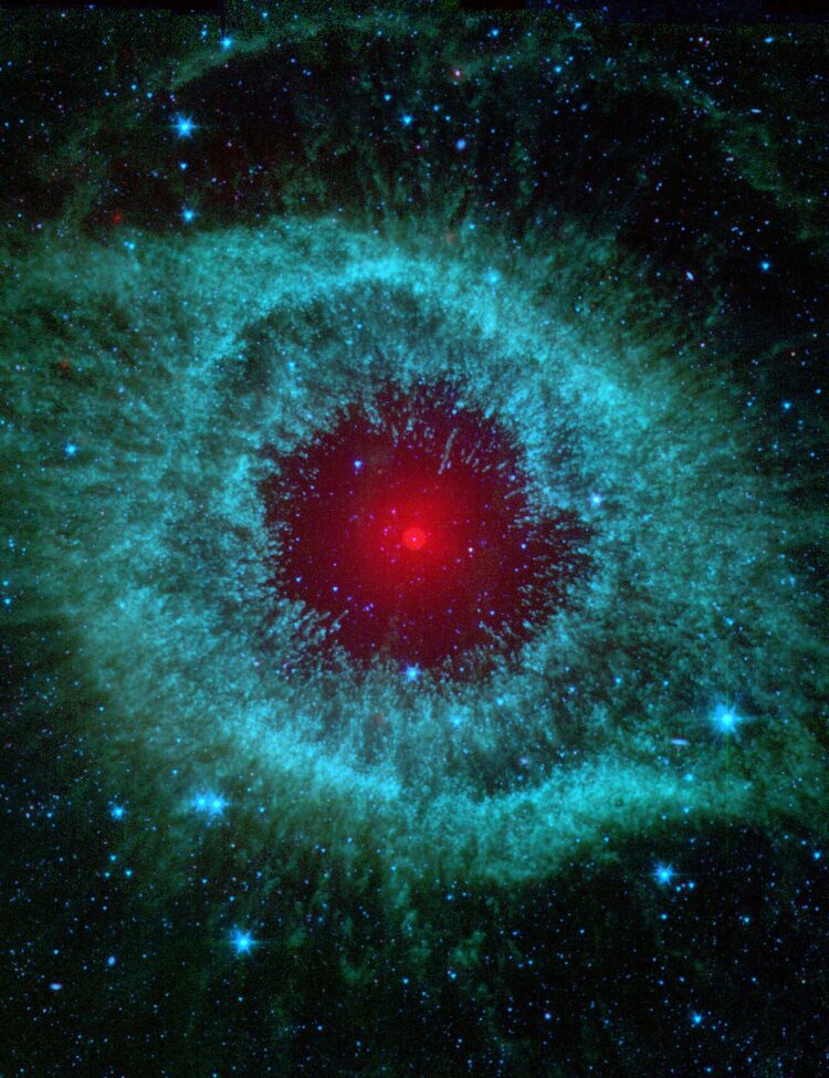 This infrared image from NASA's Spitzer Space Telescope shows the Helix Nebula, a cosmic starlet often photographed by amateur astronomers for its vivid colors and eerie resemblance to a giant eye.