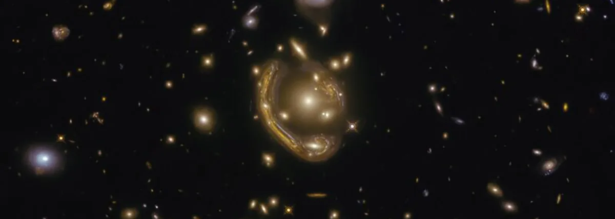 The narrow galaxy elegantly curving around its spherical companion in this image is a fantastic example of a truly strange and very rare phenomenon.