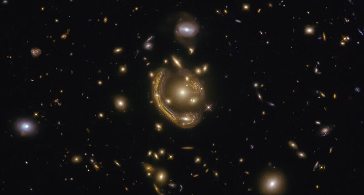 The narrow galaxy elegantly curving around its spherical companion in this image is a fantastic example of a truly strange and very rare phenomenon.