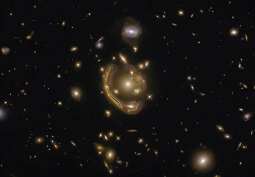 The narrow galaxy elegantly curving around its spherical companion in this image is a fantastic example of a truly strange and very rare phenomenon.