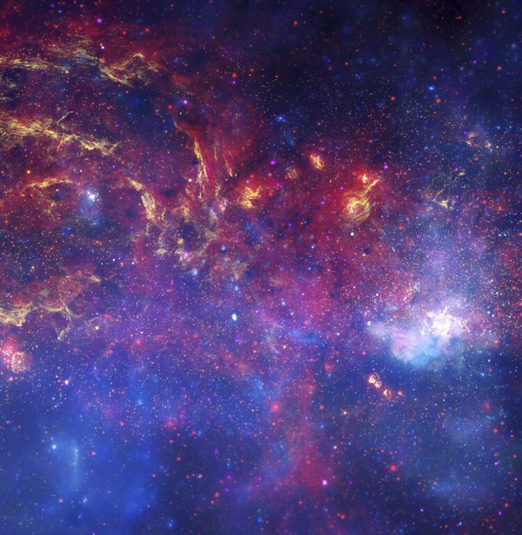 In celebration of the International Year of Astronomy 2009, NASA's Great Observatories -- the Hubble Space Telescope, the Spitzer Space Telescope, and the Chandra X-ray Observatory -- have produced a matched trio of images of the central region of our Milky Way galaxy. Each image shows the telescope's different wavelength view of the galactic center region, illustrating the unique science each observatory conducts. In this spectacular image, observations using infrared light and X-ray light see through the obscuring dust and reveal the intense activity near the galactic core.