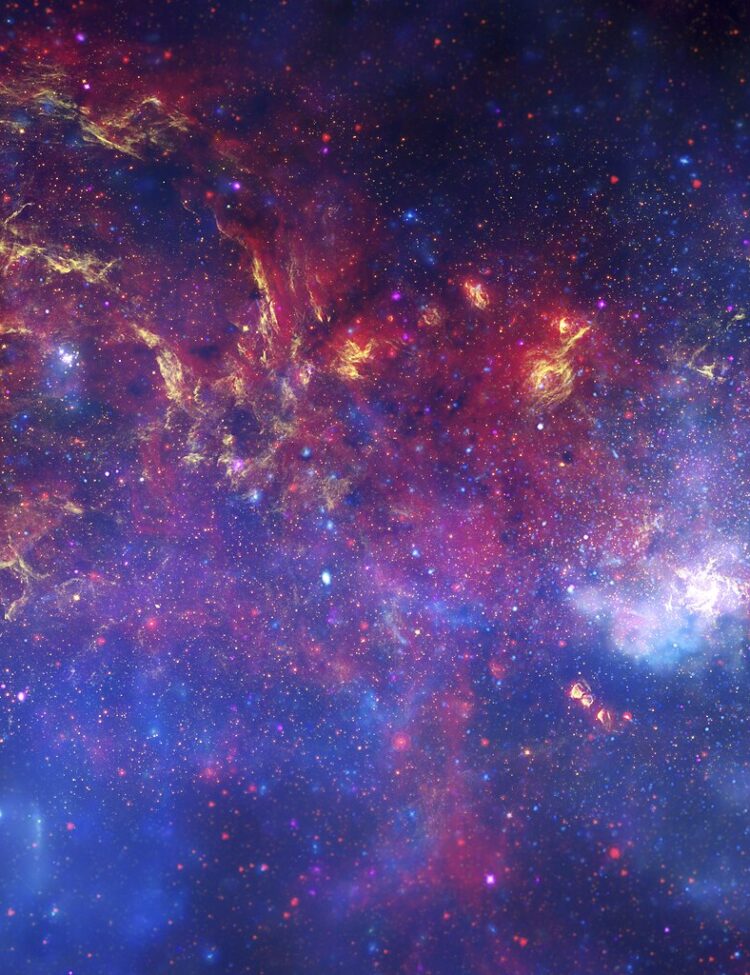 In celebration of the International Year of Astronomy 2009, NASA's Great Observatories -- the Hubble Space Telescope, the Spitzer Space Telescope, and the Chandra X-ray Observatory -- have produced a matched trio of images of the central region of our Milky Way galaxy. Each image shows the telescope's different wavelength view of the galactic center region, illustrating the unique science each observatory conducts. In this spectacular image, observations using infrared light and X-ray light see through the obscuring dust and reveal the intense activity near the galactic core.