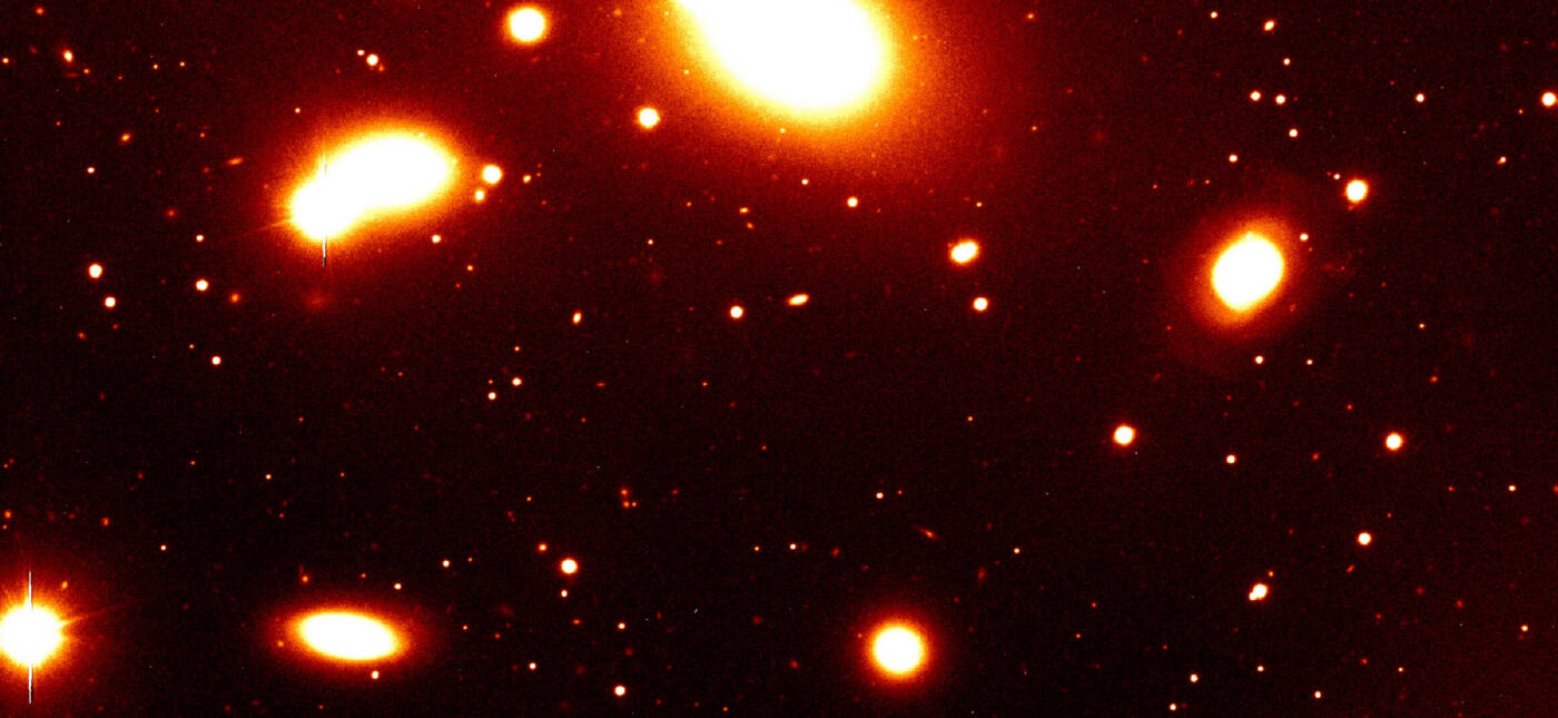 Nearby galaxy group RXCJ0937.9-2020 at a redshift of z = 0.034. It is dominated by the massive elliptical galaxy seen at the top of the image. The photo covers only the southern part of this group. Such galaxy groups with typical masses of a few 1013 solar masses constitute the smallest objects included in the REFLEX catalogue. This image was obtained with the FORS1 multi-mode instrument on the ESO 8.2-m VLT Antu telescope.
