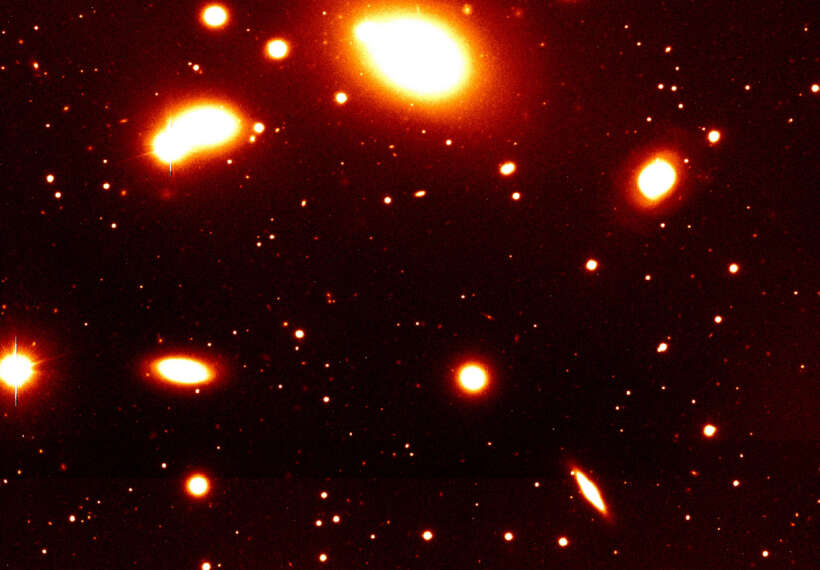 Nearby galaxy group RXCJ0937.9-2020 at a redshift of z = 0.034. It is dominated by the massive elliptical galaxy seen at the top of the image. The photo covers only the southern part of this group. Such galaxy groups with typical masses of a few 1013 solar masses constitute the smallest objects included in the REFLEX catalogue. This image was obtained with the FORS1 multi-mode instrument on the ESO 8.2-m VLT Antu telescope.