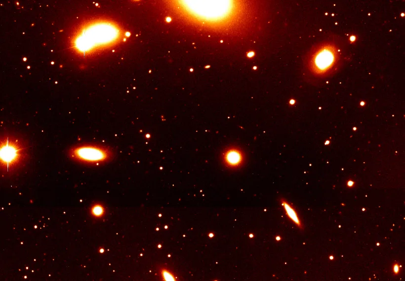 Nearby galaxy group RXCJ0937.9-2020 at a redshift of z = 0.034. It is dominated by the massive elliptical galaxy seen at the top of the image. The photo covers only the southern part of this group. Such galaxy groups with typical masses of a few 1013 solar masses constitute the smallest objects included in the REFLEX catalogue. This image was obtained with the FORS1 multi-mode instrument on the ESO 8.2-m VLT Antu telescope.