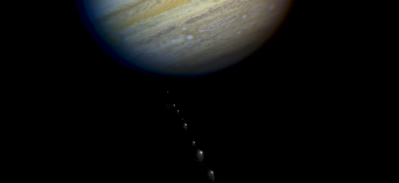 This is a composite photo, assembled from separate images of Jupiter and Comet P/Shoemaker-Levy 9, as imaged by the Wide Field & Planetary Camera 2 (WFPC2), aboard. NASA's Hubble Space Telescope (HST).