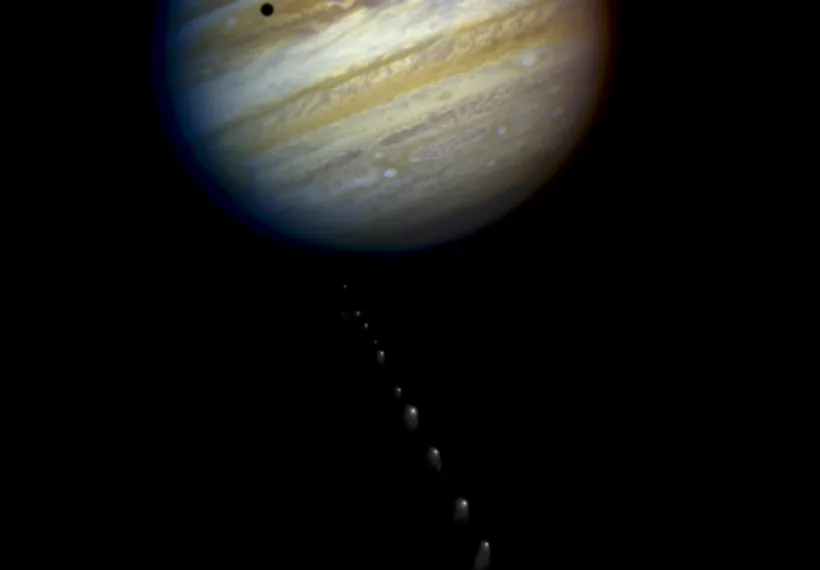 This is a composite photo, assembled from separate images of Jupiter and Comet P/Shoemaker-Levy 9, as imaged by the Wide Field & Planetary Camera 2 (WFPC2), aboard. NASA's Hubble Space Telescope (HST).