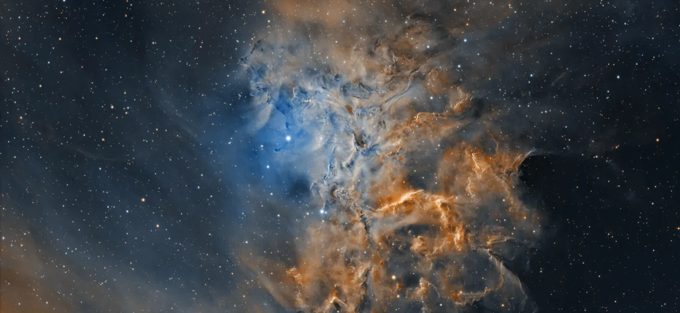 Flaming Star Nebula (IC 405) captured with narrowband filters and processed in the Hubble Palette. Captured by amateur astronomer Chuck Ayoub in Redford, Michigan, USA.